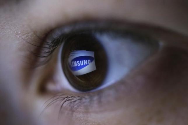 A picture illustration shows Samsung's logo reflected in a person's eye, in central Bosnian town of Zenica, March 13, 2015. REUTERS/Dado Ruvic