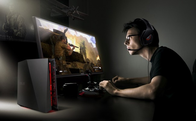 Man sitting at computer desk at night